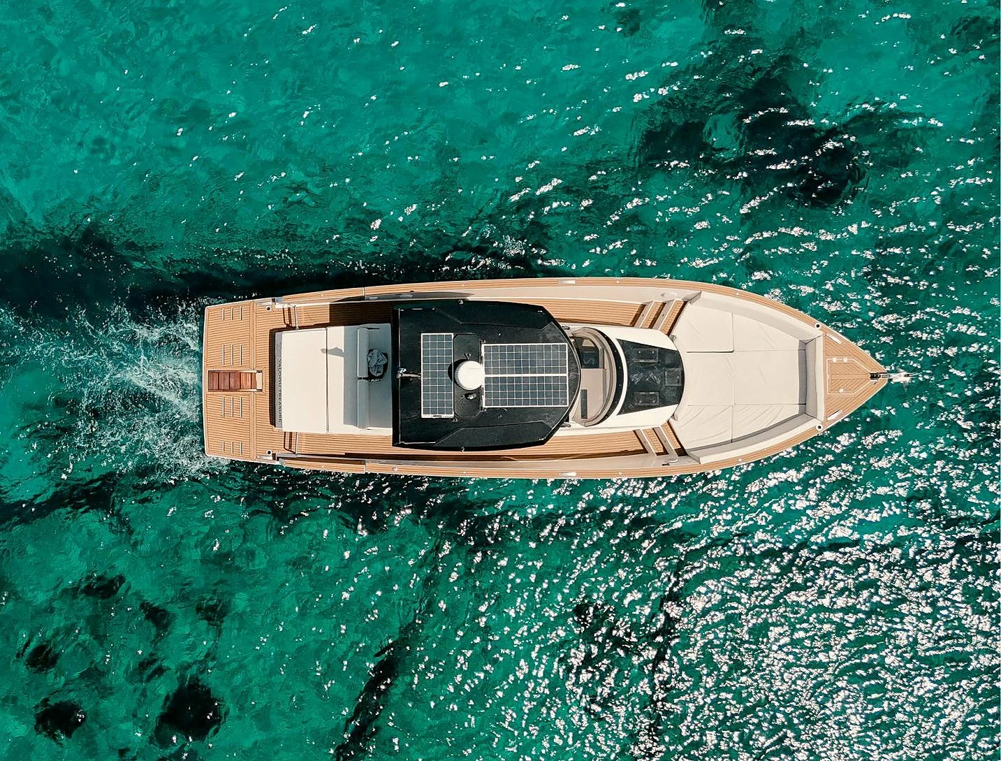 Tesoro 42 day cruiser top-down on turquoise water